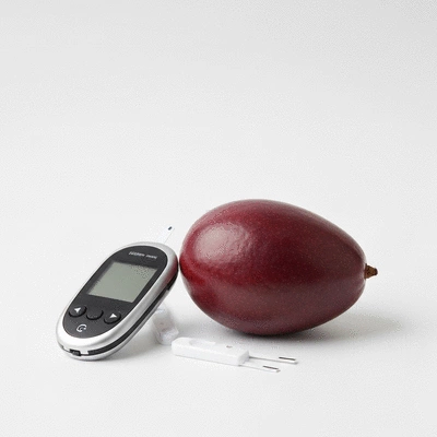 African mango fruit with blood sugar monitoring tools