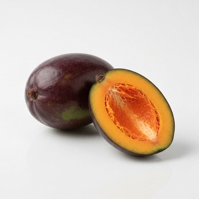 African mango fruit with cross-section showing fibrous interior, on a clean, light surface, no text, no words, no typography, 8K, product photography